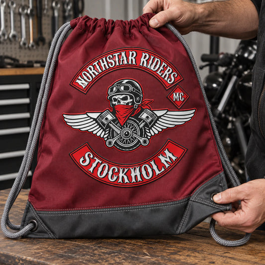 Heavy polyester motorcycle club drawstring bag with reinforced seams, cords and eyelets.