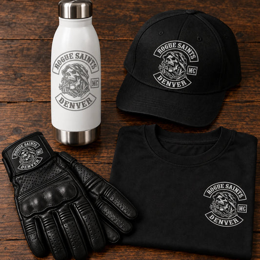 club gear kit with logo bottle, gloves, cap and folded shirt on a solid clubhouse table for a motorcycle club.