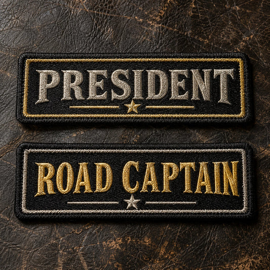 Tasteful metallic silver and gold thread details on traditional motorcycle club name bars, restrained premium finish, showing custom motorcycle club name bar patch options.
