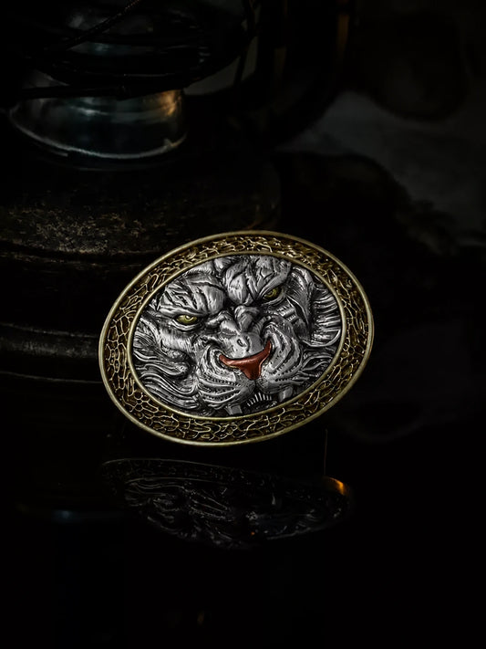 mixed-metal tiger head biker belt buckle on dark studio background