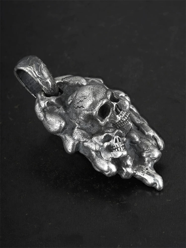 Molten double-skull sterling silver biker pendant, angled view