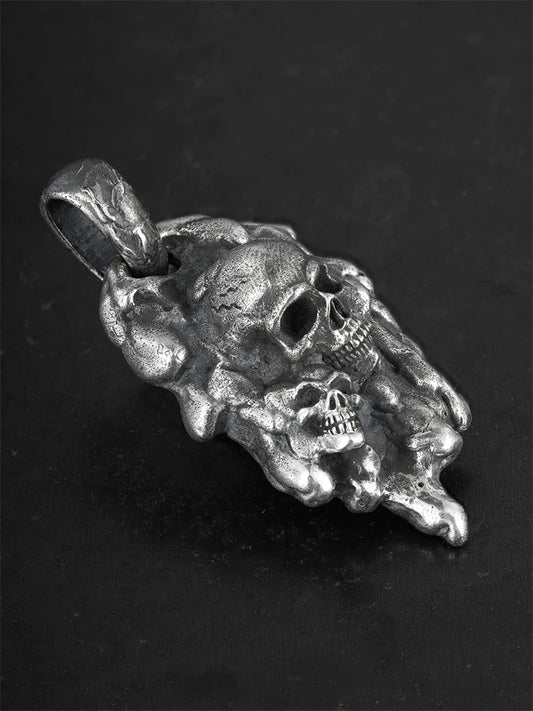 Molten double-skull sterling silver biker pendant, angled view