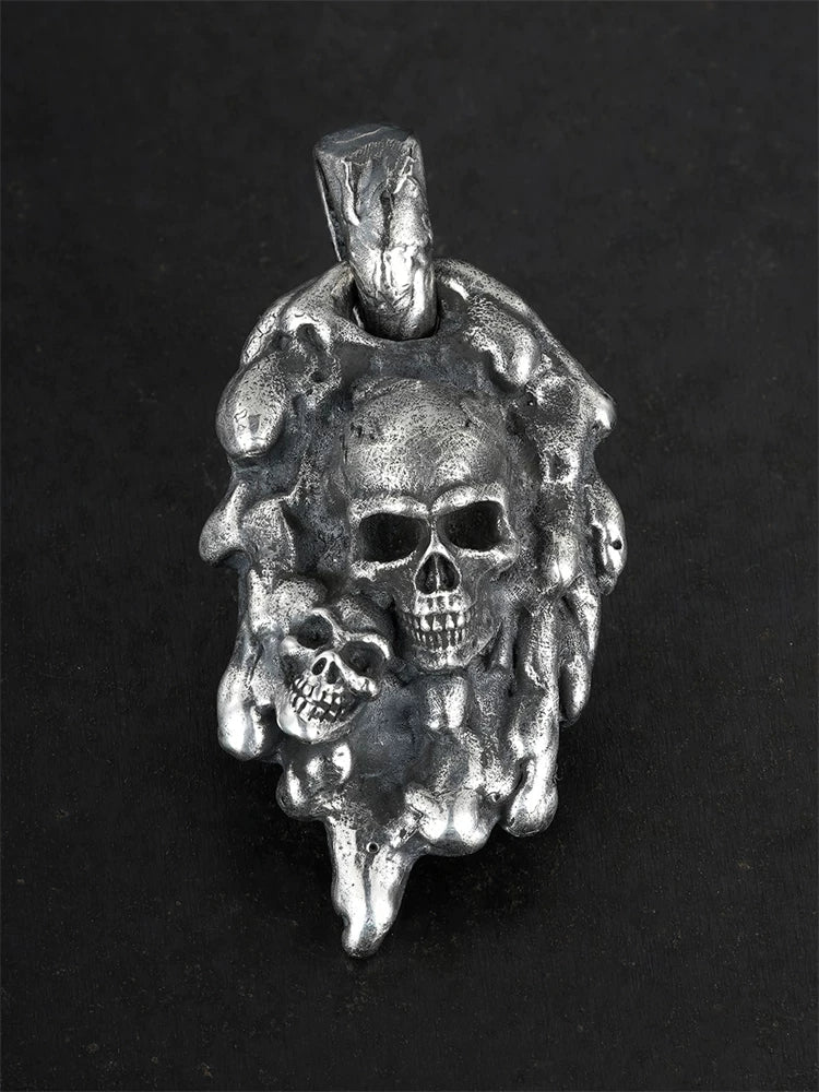 Molten double-skull sterling silver biker pendant, front view