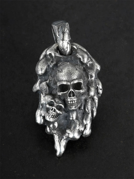 Molten double-skull sterling silver biker pendant, front view