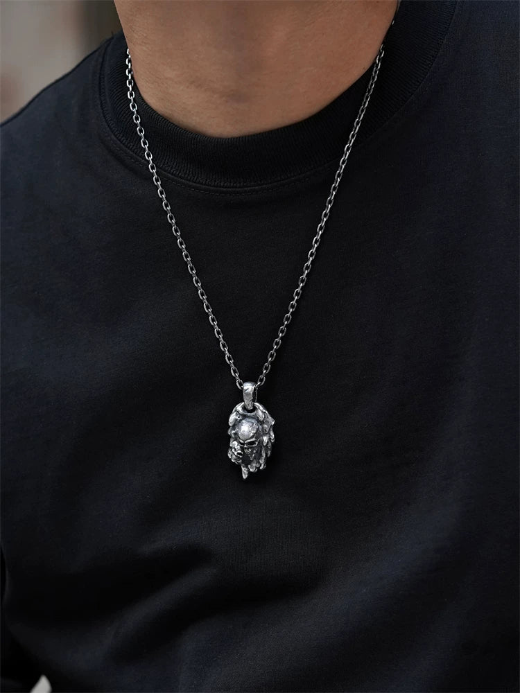 Molten double-skull sterling silver biker pendant on model