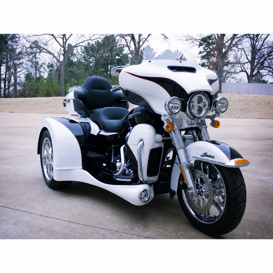White Harley trike with full-length side body kit installed