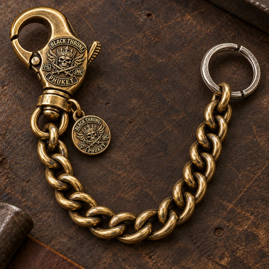 Custom motorcycle club lobster clasp shown as a physically plausible working spring-loaded clasp on denim.