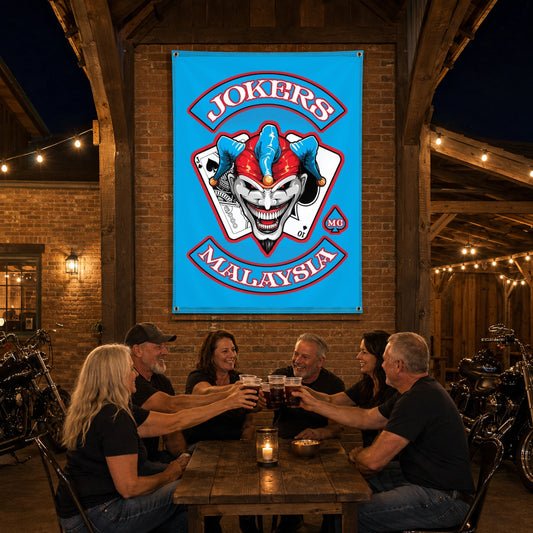 Chapter members celebrating their history in front of a custom motorcycle club anniversary banner.