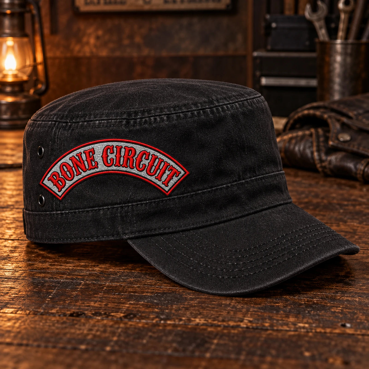 Right-side view of a black motorcycle club military cadet cap with the approved Bone Circuit name rocker.