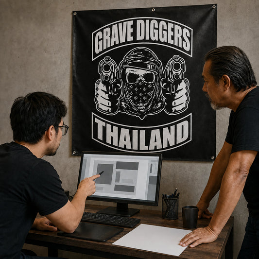 A designer developing a custom motorcycle club banner concept from authorized logo artwork.