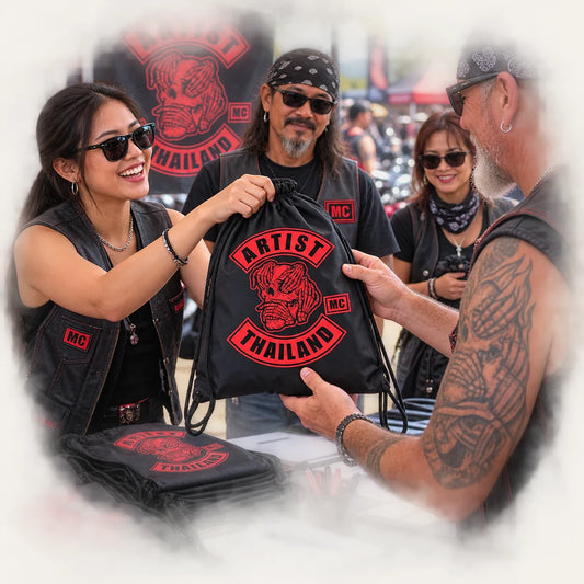 Motorcycle club riders arriving at an organized rally field with event flags.