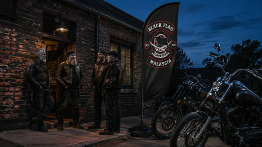 A Custom Flag That Represents Your Motorcycle Club Story: custom motorcycle club feather flag shown in veteran chapter founders outside a weathered brick clubhouse at blue hour with unbranded American V-twin motorcycles.