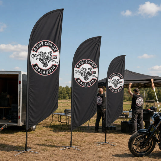 Custom Size Options: custom motorcycle club feather flag shown in event crew setting up a chapter gathering on an open rally field.