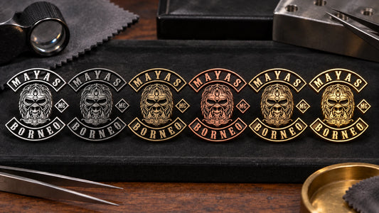 Custom motorcycle club jewelry arranged to compare silver, brass, copper, gold and mixed-metal appearances.