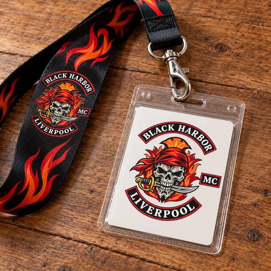A clear credential sleeve connected to a club-logo lanyard through its reinforced upper slot.