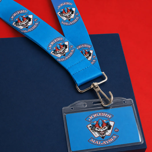 A J-hook connecting a printed motorcycle club lanyard to a badge-holder slot.