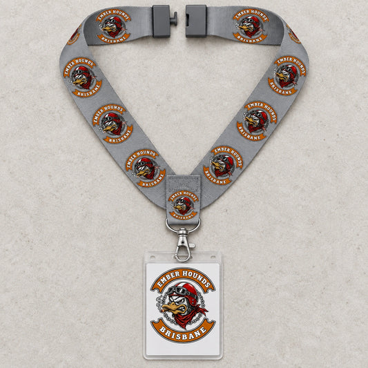 An Ember Hounds lanyard laid flat with its neck-loop breakaway connector separated.