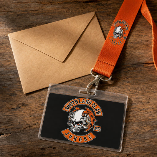 A club organizer arranging logo artwork and a lanyard sample with event-planning materials.