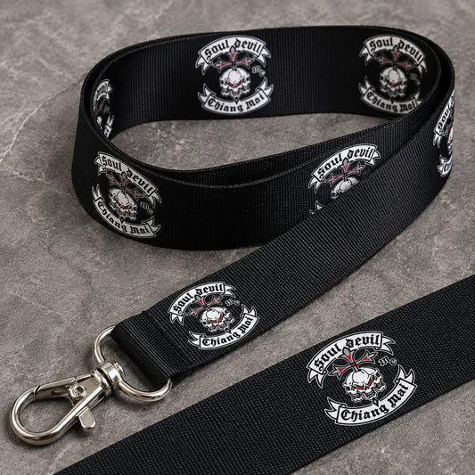Close-up of a printed polyester motorcycle club lanyard showing fabric weave, logo repeat and swivel clasp.