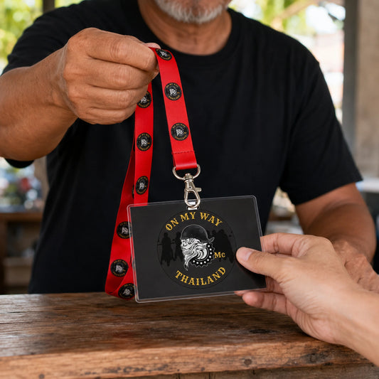 A rally volunteer handing a club-logo lanyard and event credential to an arriving rider.