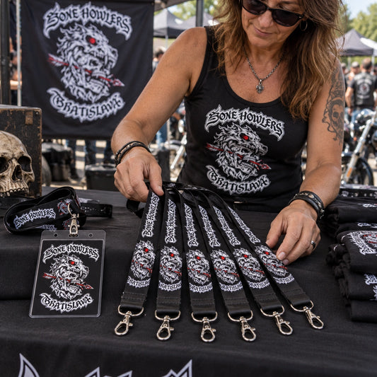 A rally merchandise display of nylon club-logo lanyards and matching credential sets.