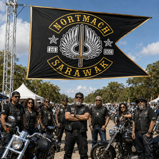 Large-format motorcycle club swallowtail flag marking the entrance to an outdoor rally.