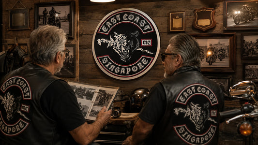 Custom motorcycle club logo wall sign displayed in a vintage biker clubhouse.