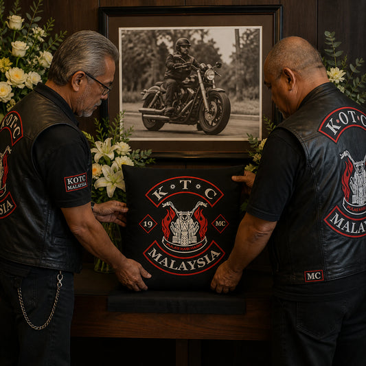 Motorcycle club members place a respectful custom memorial cushion in a clubhouse remembrance display.