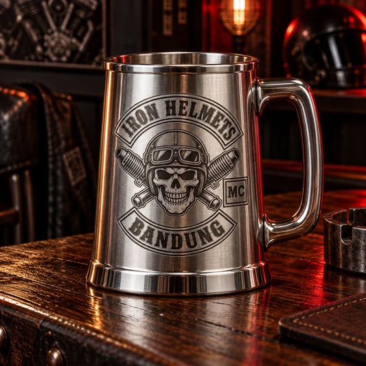 Substantial stainless tankard with broad handle displaying an authorized logo for a custom motorcycle club metal mug project.