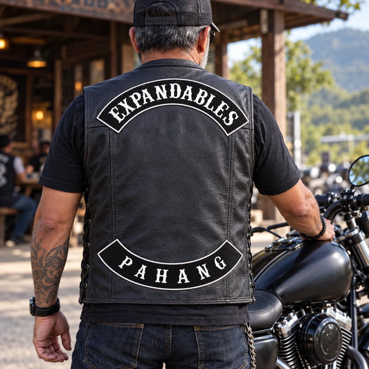 New motorcycle club chapter gear prepared with coordinated rocker patches and vest placement.