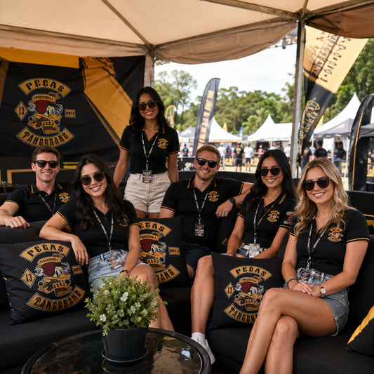 Matching motorcycle club cushions furnish a branded rally booth hospitality area.