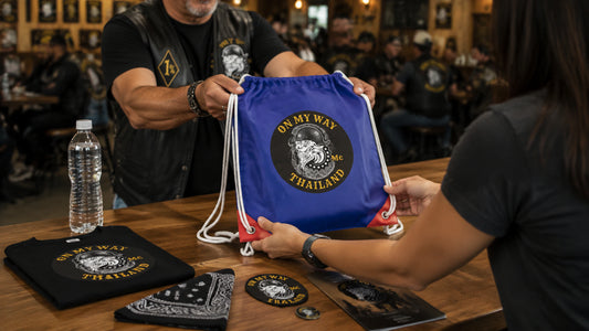 Chapter volunteers pack a realistically sized motorcycle rally registration drawstring bag.
