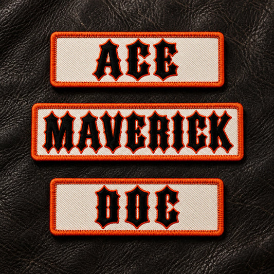 Three premium embroidered road-name bar patches presented on worn black leather, each using the same construction standard but different short road-name wording, showing custom motorcycle club name bar patch options.