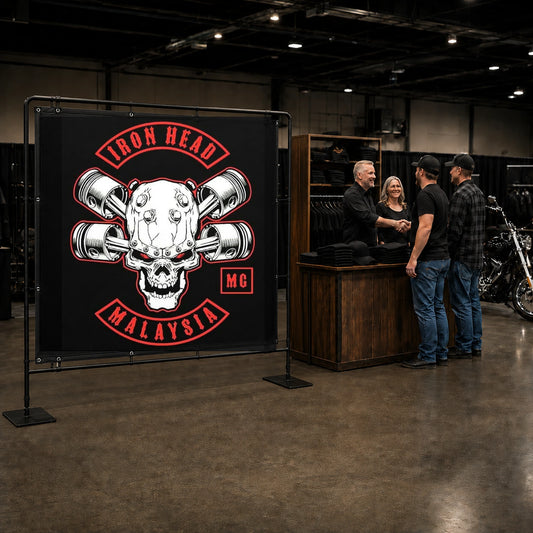 A professional custom motorcycle club banner displayed at a busy bike show booth.