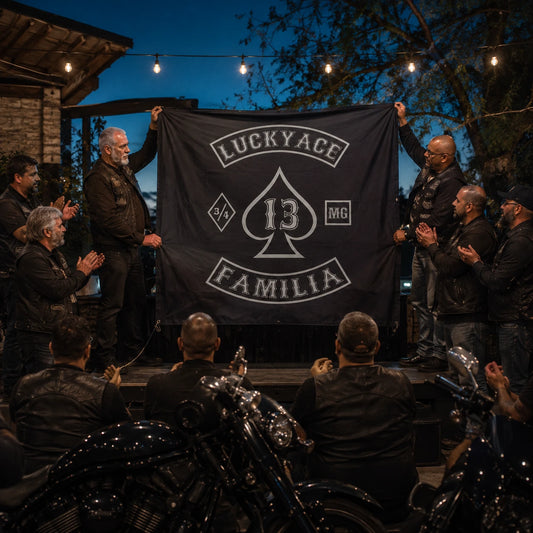 Motorcycle club officers present a custom square flag during an outdoor milestone celebration.