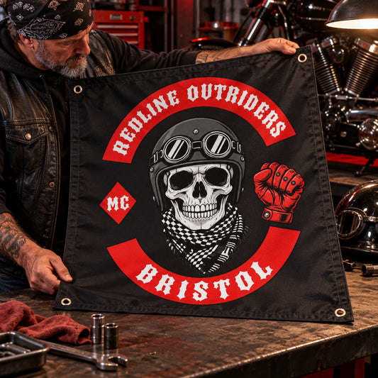 A mature rider inspects the printed logo, reinforced seams and grommets on a custom Redline Outriders square flag.