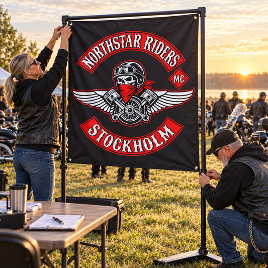 Volunteers secure a Northstar Riders square flag as V-twin riders arrive at a sunrise rally.