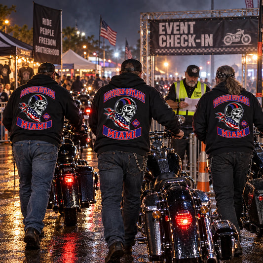 Motorcycle club members in coordinated black hoodies entering a rain-slick night rally checkpoint.