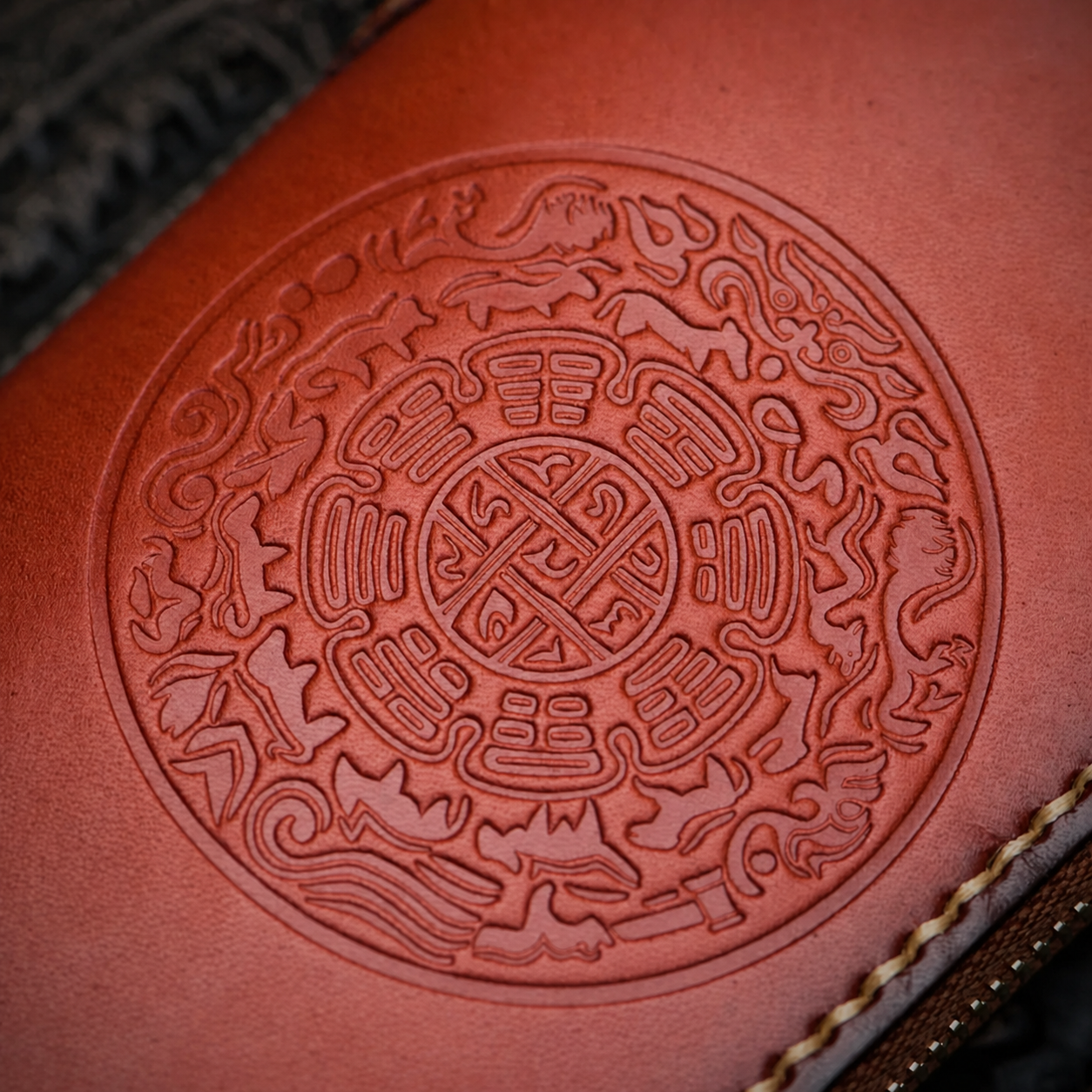 close-up of nine-palace embossed tooling on brown full-grain leather biker wallet