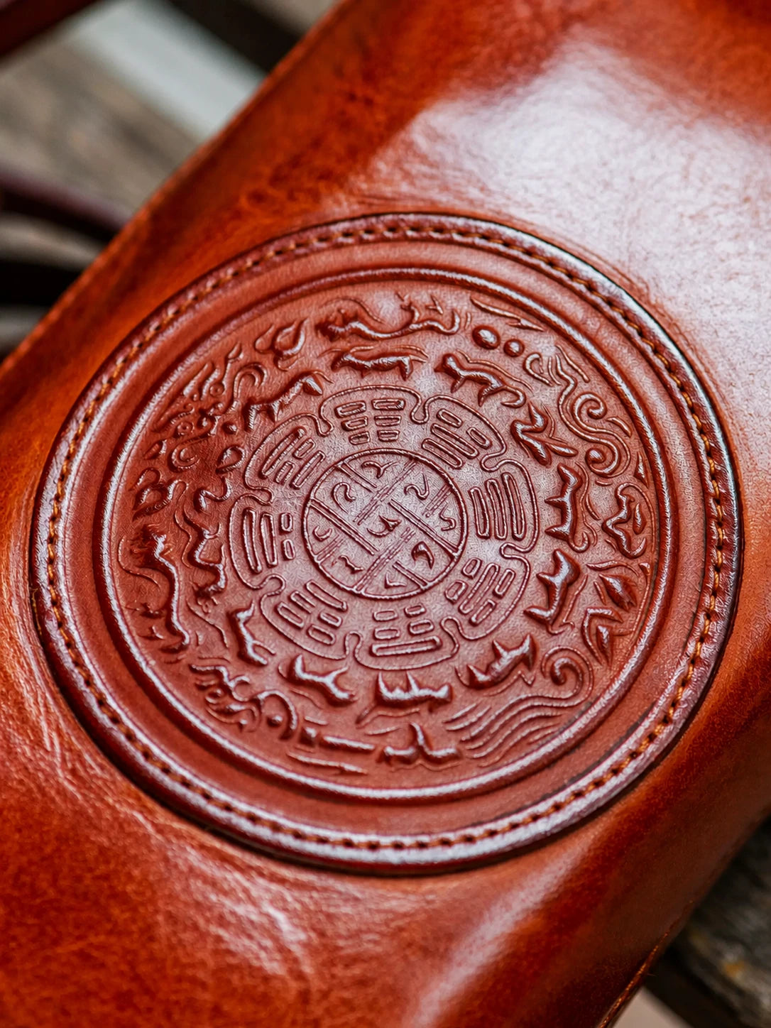embossed nine-palace medallion on top-grain leather biker wallet