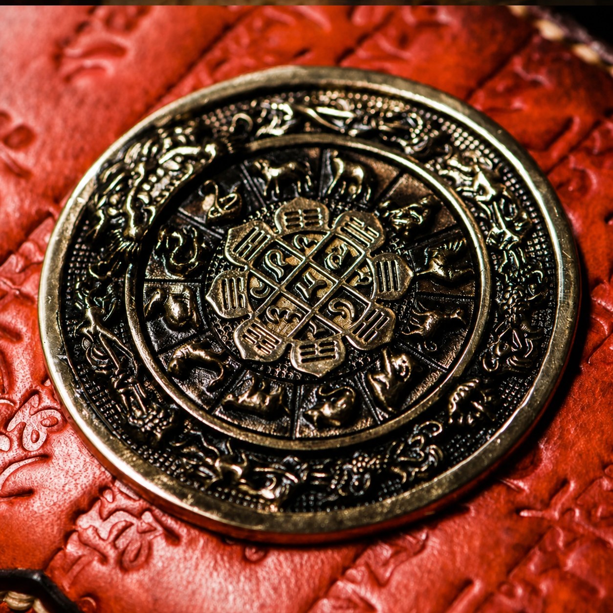 Nine Palace brass medallion and hand-tooled leather detail
