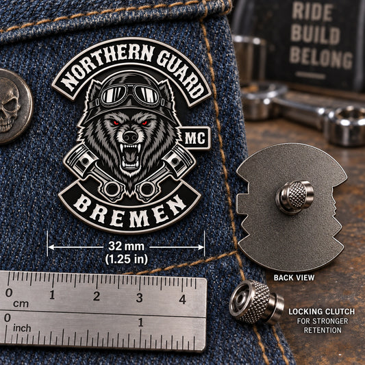 One-and-a-quarter-inch motorcycle club pin on denim with a secure locking clutch.