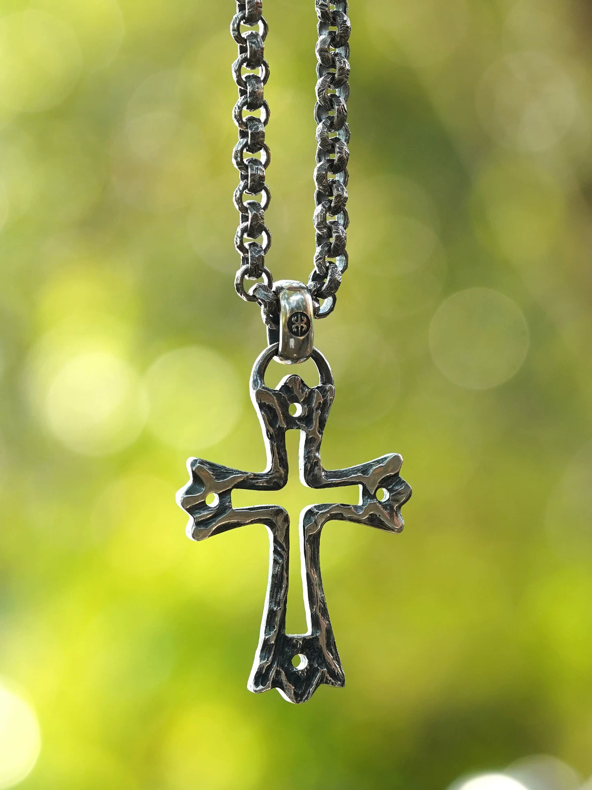 Openwork bone cross sterling silver biker pendant worn on chain