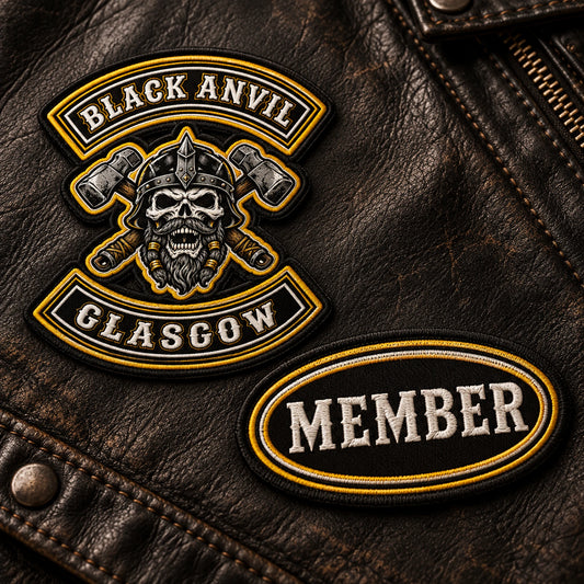 Oval heritage-lettering chest patch for a motorcycle club, shown at aged black leather panel.