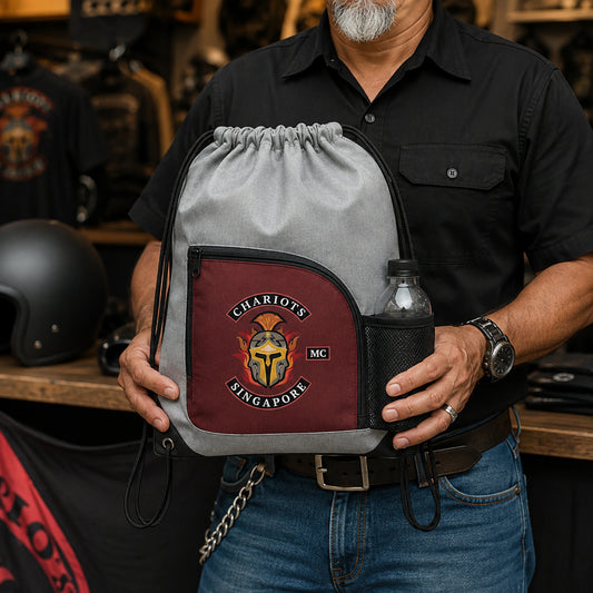Event staff member holds a realistically sized motorcycle club pocket drawstring bag.