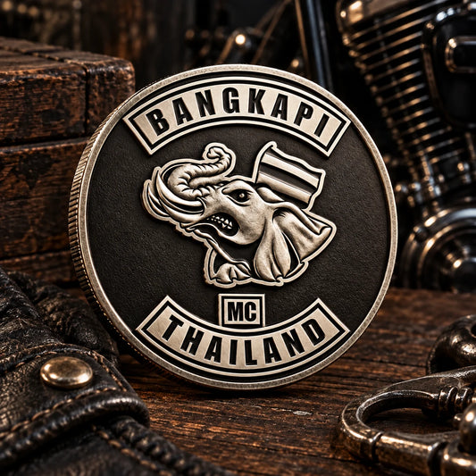 Polished silver motorcycle club challenge coin with smooth dimensional metal relief.