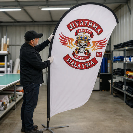 Professional Production Quality: custom motorcycle club feather flag shown in quality inspector under bright neutral production lighting.