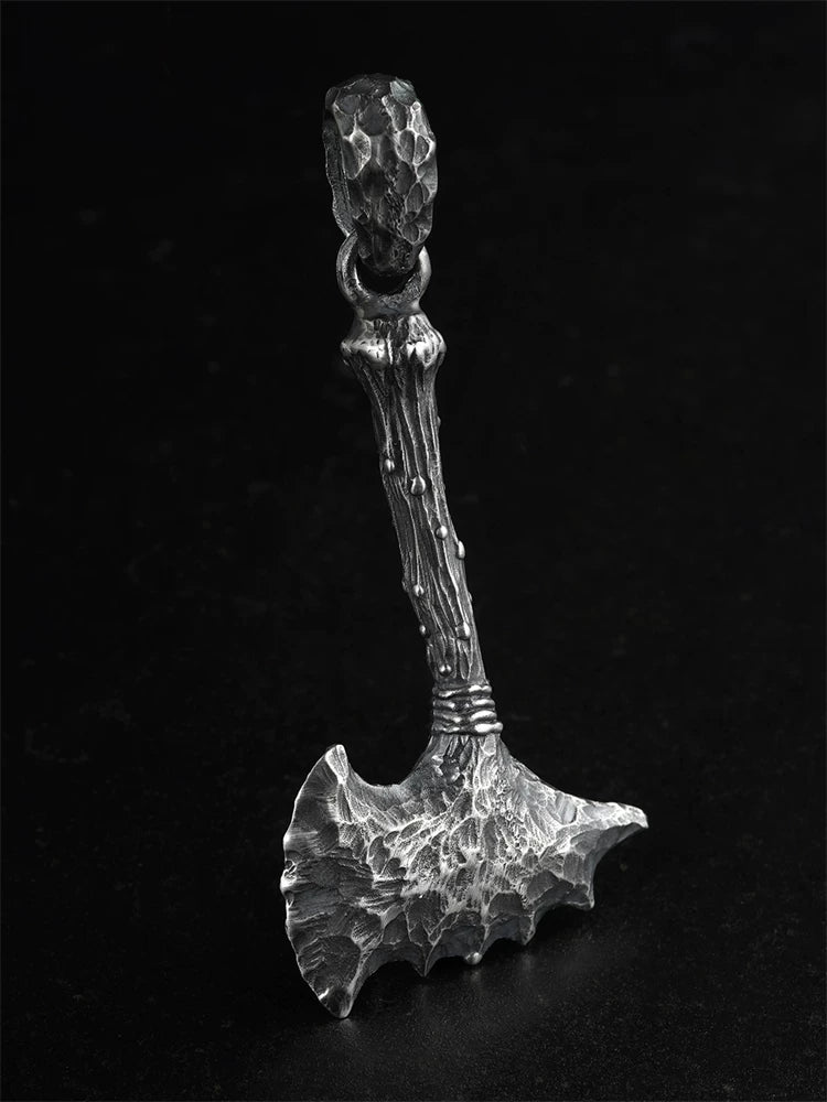 Raw stone axe sterling silver biker pendant on a black background