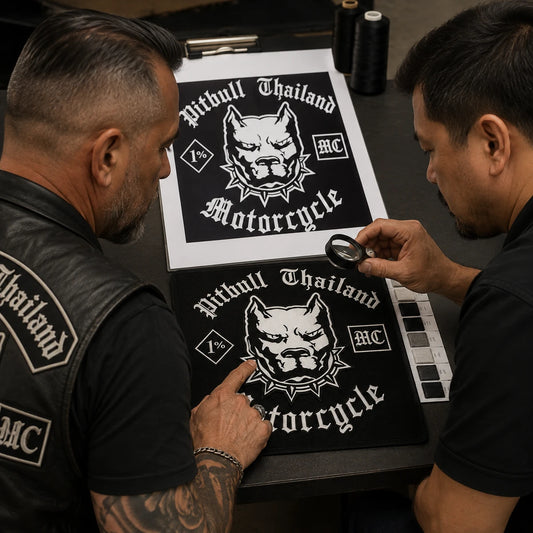 Motorcycle club officer reviewing lettering, thread colors and an embroidered back patch sample.