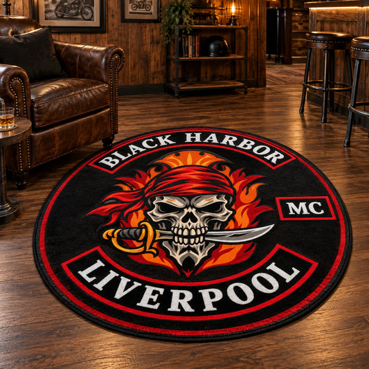 An oval motorcycle club rug presents approved badge-inspired artwork on a clubhouse floor.